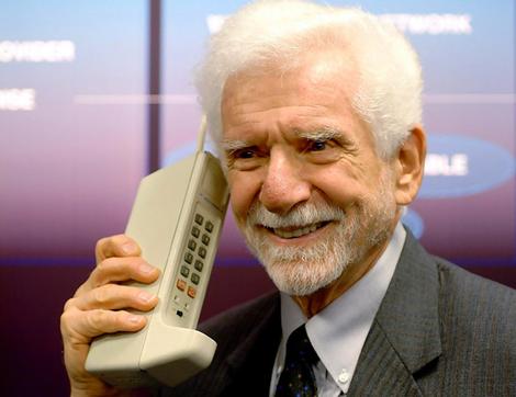 Martin Cooper with the first cell phone